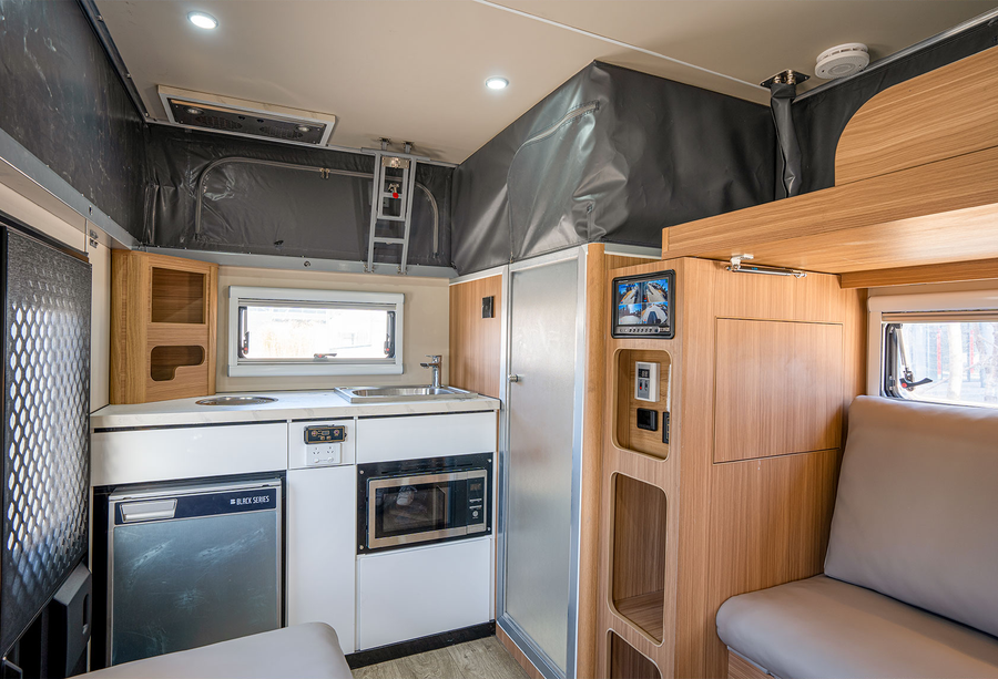 HQ12 indoor kitchen with lounge seating and storage