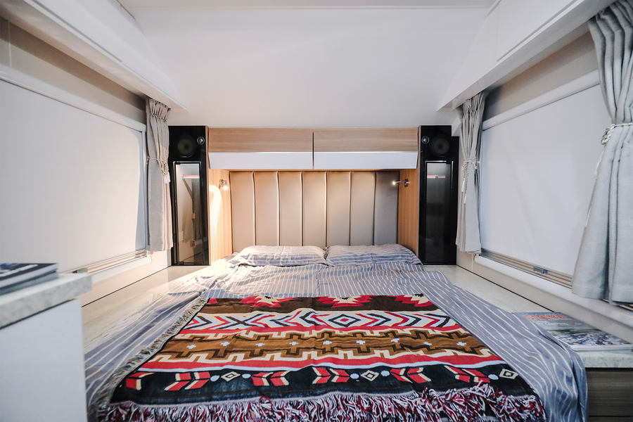 HQ19 fixed queen bed with upholstered headboard and bedside storage